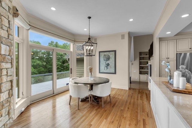 11193 Bluestem Ln, Eden Prairie, MN 55347 - dining room featuring a chandelier, recessed lighting, light wood finished floors, and ornamental molding