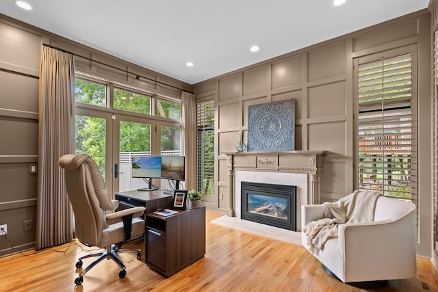 11193 Bluestem Ln, Eden Prairie, MN 55347 - office space featuring a decorative wall, wood finished floors, a fireplace, and recessed lighting