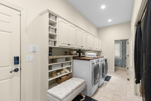 11193 Bluestem Ln, Eden Prairie, MN 55347 - laundry area with cabinet space, washing machine and clothes dryer, recessed lighting, and light tile patterned floors