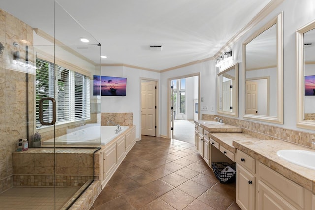 11193 Bluestem Ln, Eden Prairie, MN 55347 - bathroom with double vanity, a bath, a stall shower, ornamental molding, and recessed lighting