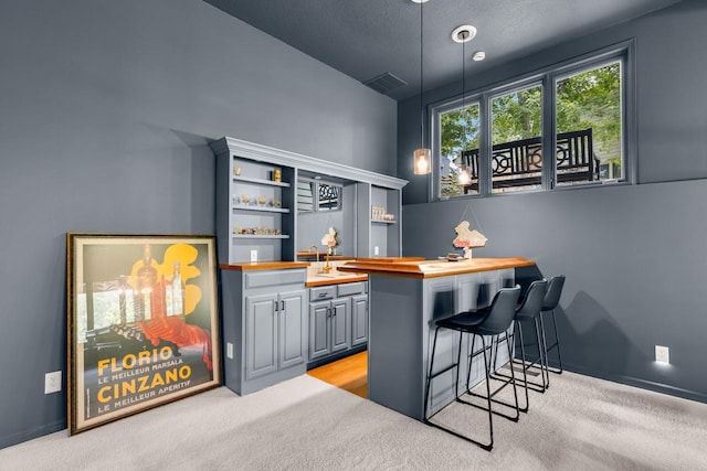 11193 Bluestem Ln, Eden Prairie, MN 55347 - bar area with light colored carpet and pendant lighting