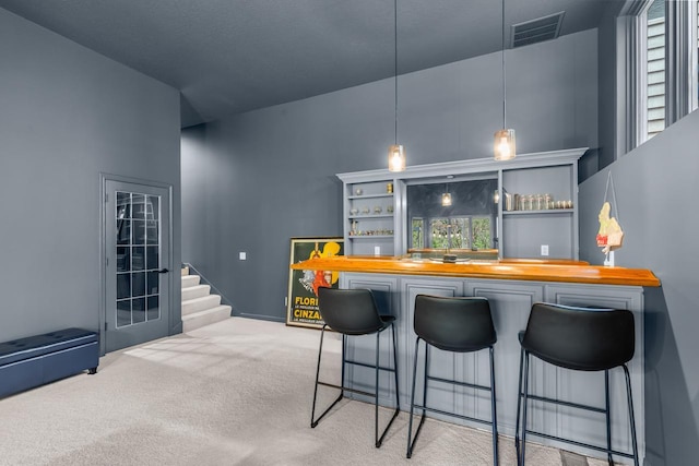 11193 Bluestem Ln, Eden Prairie, MN 55347 - indoor wet bar with carpet floors and pendant lighting