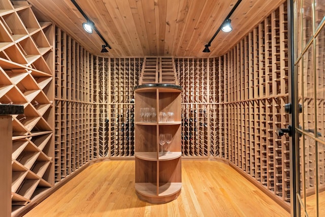 11193 Bluestem Ln, Eden Prairie, MN 55347 - wine room with track lighting, wood finished floors, and wooden ceiling