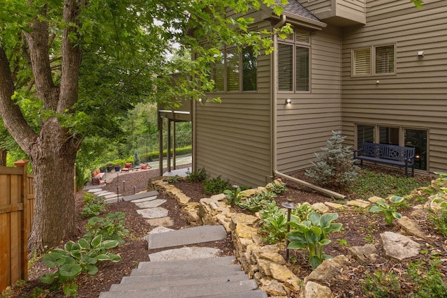 11193 Bluestem Ln, Eden Prairie, MN 55347 - view of side of home with roof with shingles and stairway