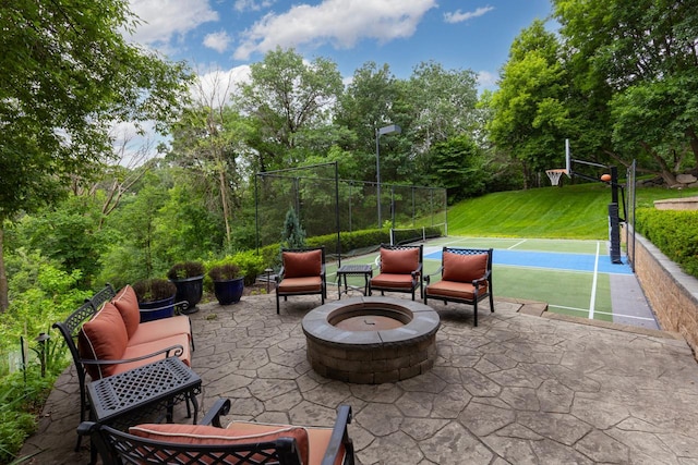11193 Bluestem Ln, Eden Prairie, MN 55347 - view of patio featuring an outdoor fire pit and view of wooded area