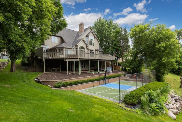 11193 Bluestem Ln, Eden Prairie, MN 55347 - rear view of house featuring a tennis court, a chimney, and a wooden deck