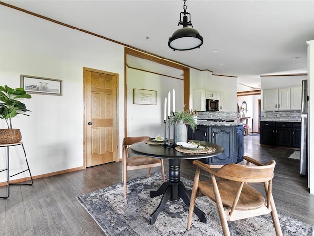 33498 175th St NE, Morrill Twp, MN 56329 - dining room featuring dark wood-type flooring and ornamental molding