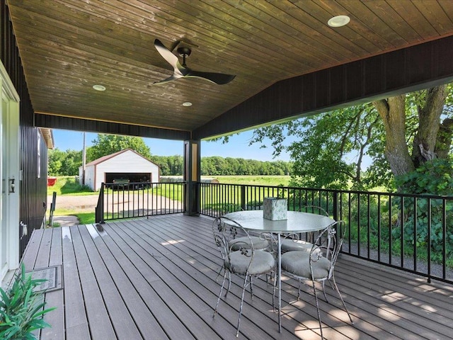 33498 175th St NE, Morrill Twp, MN 56329 - deck featuring an outbuilding, outdoor dining space, and ceiling fan