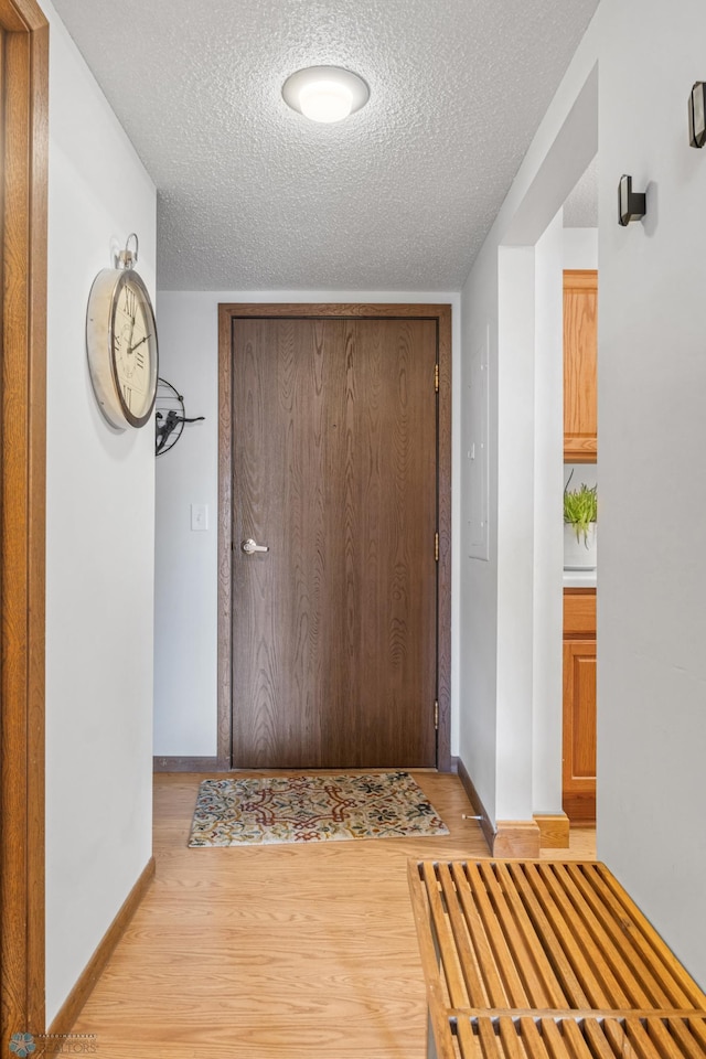 1110 3rd Ave N Unit 201E, Fargo, ND 58102 - corridor with a textured ceiling and light wood finished floors