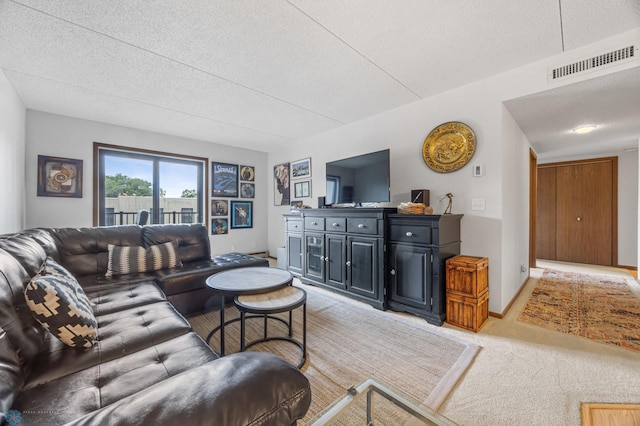 1110 3rd Ave N Unit 201E, Fargo, ND 58102 - living room with light carpet and a textured ceiling