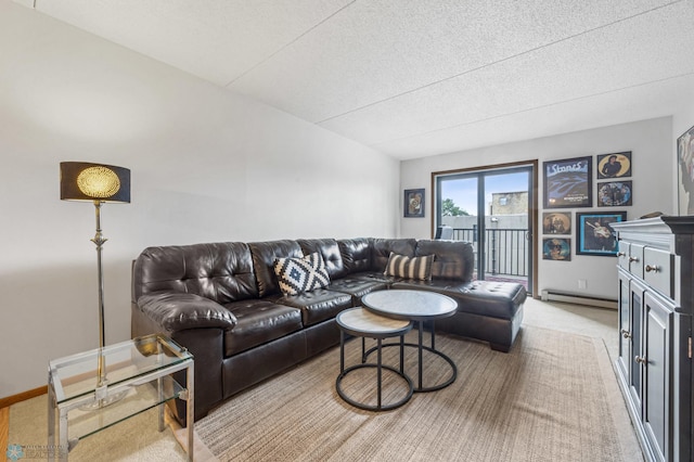1110 3rd Ave N Unit 201E, Fargo, ND 58102 - living room with baseboard heating, light colored carpet, and a textured ceiling