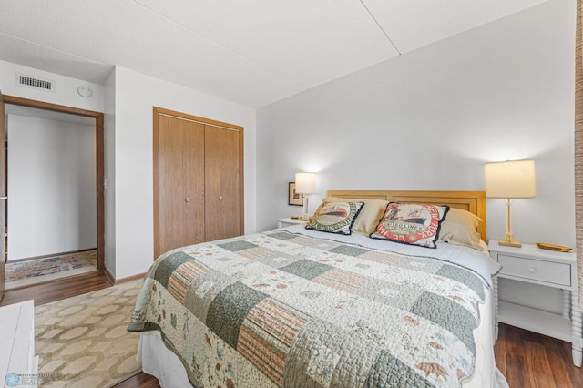 1110 3rd Ave N Unit 201E, Fargo, ND 58102 - bedroom featuring wood finished floors and a closet