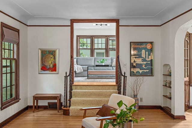 947 Stryker Ave W, Saint Paul, MN 55118 - sitting room with wood finished floors, arched walkways, and built in shelves