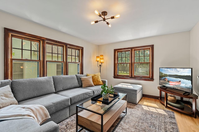 947 Stryker Ave W, Saint Paul, MN 55118 - living room featuring a chandelier and light wood-type flooring