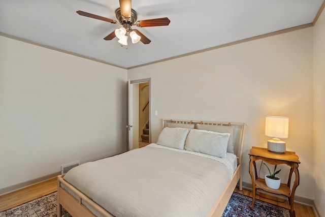 947 Stryker Ave W, Saint Paul, MN 55118 - bedroom with wood finished floors, ceiling fan, and ornamental molding