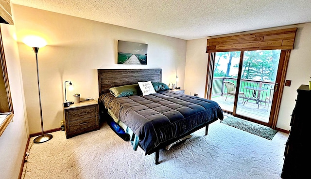 44512 276th Ln, Aitkin, MN 56431 - carpeted bedroom with access to exterior and a textured ceiling