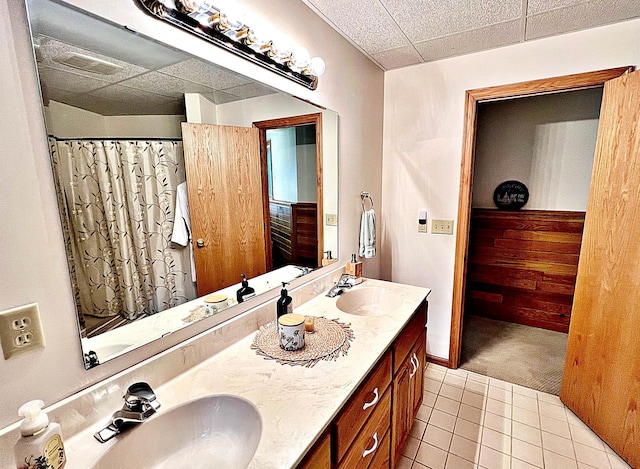 44512 276th Ln, Aitkin, MN 56431 - bathroom featuring a paneled ceiling, double vanity, and tile patterned floors