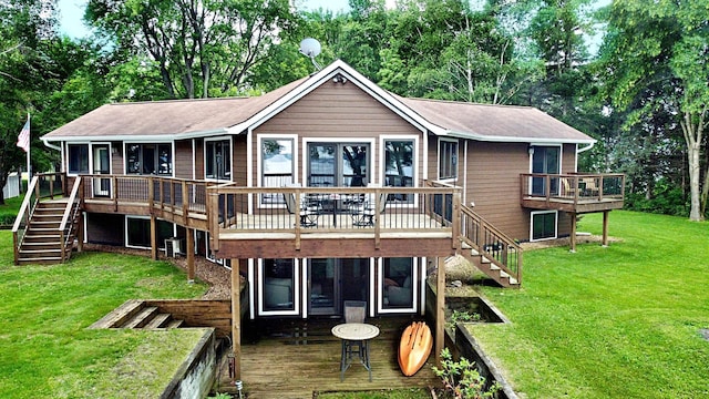 44512 276th Ln, Aitkin, MN 56431 - rear view of property featuring stairway, a deck, a yard, and a shingled roof