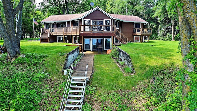 44512 276th Ln, Aitkin, MN 56431 - rear view of property featuring stairs, a deck, and a lawn
