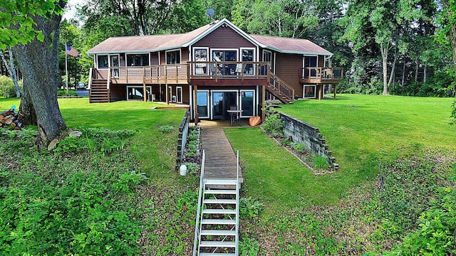 44512 276th Ln, Aitkin, MN 56431 - back of property featuring stairs, a wooden deck, and a yard