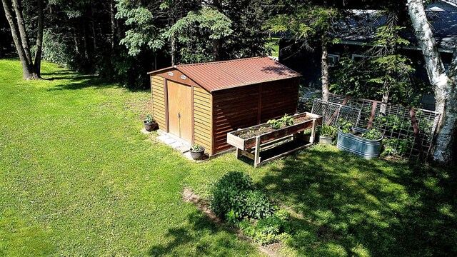 44512 276th Ln, Aitkin, MN 56431 - view of shed featuring a vegetable garden