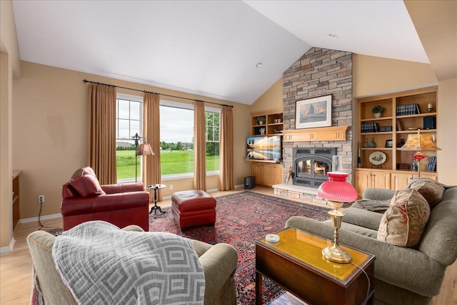 238 Muirfield Trl, Hudson, WI 54016 - living room featuring wood finished floors, a fireplace, and high vaulted ceiling