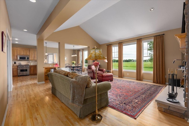 238 Muirfield Trl, Hudson, WI 54016 - living area featuring light wood-style flooring, vaulted ceiling, and recessed lighting