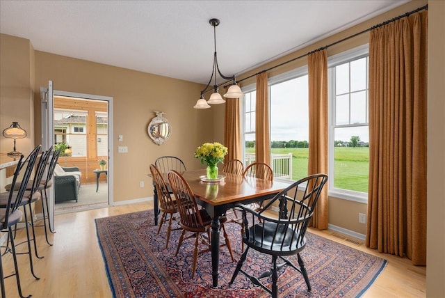 238 Muirfield Trl, Hudson, WI 54016 - dining space featuring light wood-style floors and plenty of natural light