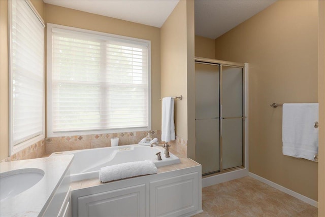 238 Muirfield Trl, Hudson, WI 54016 - full bathroom with a shower stall, a garden tub, and vanity