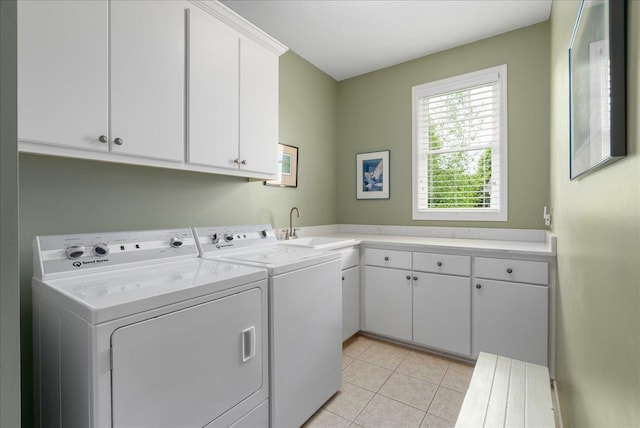 238 Muirfield Trl, Hudson, WI 54016 - laundry area featuring washing machine and clothes dryer, cabinet space, and light tile patterned floors