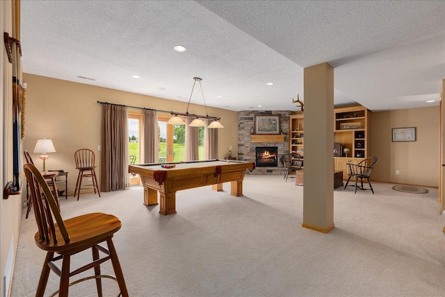 238 Muirfield Trl, Hudson, WI 54016 - game room with light colored carpet, pool table, a textured ceiling, a stone fireplace, and recessed lighting