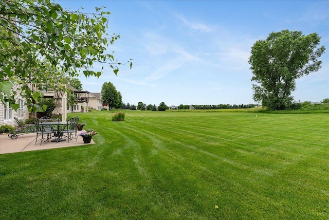 238 Muirfield Trl, Hudson, WI 54016 - view of grassy yard featuring a patio area