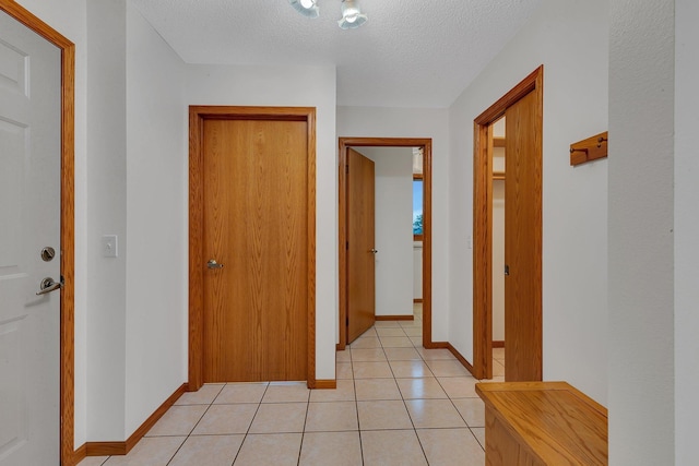 42767 190th Ave, Holding Twp, MN 56340 - corridor with a textured ceiling and light tile patterned flooring