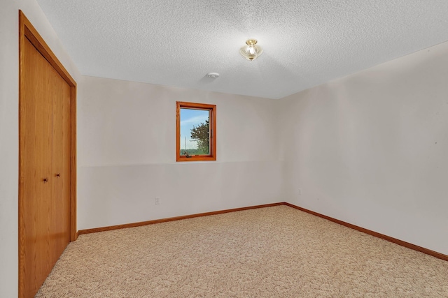42767 190th Ave, Holding Twp, MN 56340 - unfurnished bedroom featuring a closet, carpet flooring, and a textured ceiling