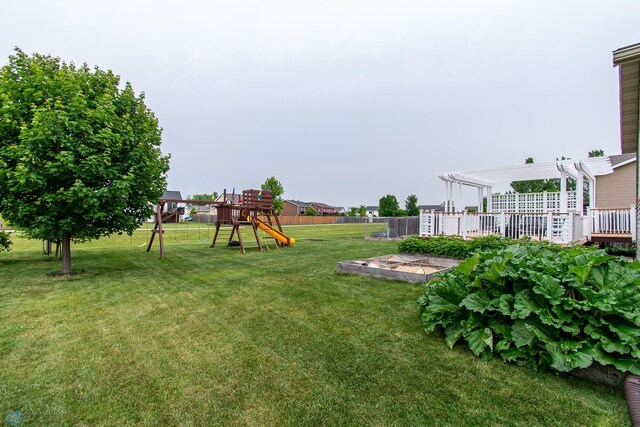 4213 15th St S, Moorhead, MN 56560 - view of yard with a playground, a pergola, and a garden
