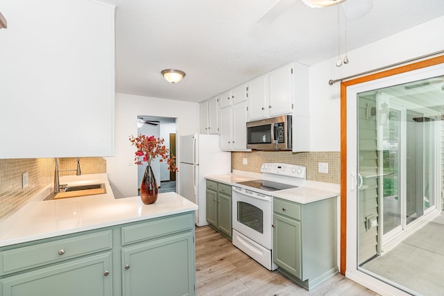 14381 Fairway Dr, Eden Prairie, MN 55344 - kitchen with white appliances, ceiling fan, tasteful backsplash, and green cabinetry