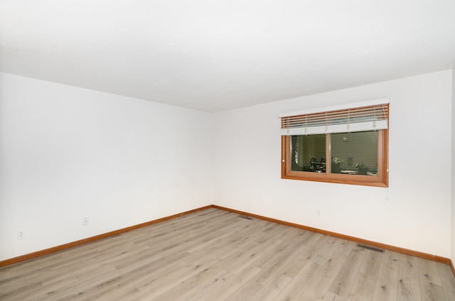 14381 Fairway Dr, Eden Prairie, MN 55344 - spare room with light wood-style floors and baseboards