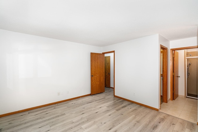 14381 Fairway Dr, Eden Prairie, MN 55344 - spare room featuring light wood-style flooring and baseboards