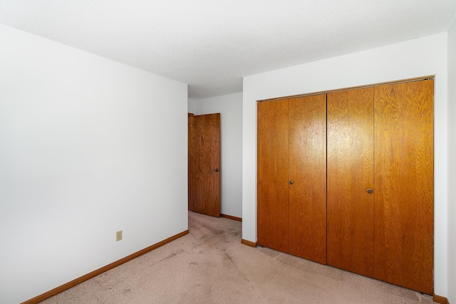 14381 Fairway Dr, Eden Prairie, MN 55344 - unfurnished bedroom featuring a closet and light colored carpet