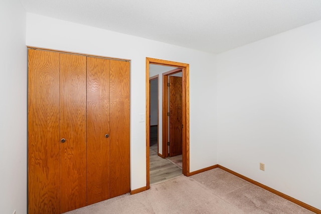 14381 Fairway Dr, Eden Prairie, MN 55344 - unfurnished bedroom featuring light colored carpet and a closet