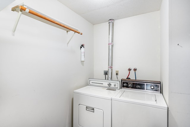 14381 Fairway Dr, Eden Prairie, MN 55344 - laundry room with washer and dryer and a textured ceiling