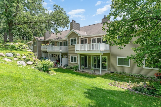 14381 Fairway Dr, Eden Prairie, MN 55344 - back of property with a lawn, a patio area, a balcony, and a chimney