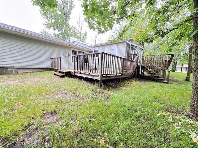 517 2nd St NW, Menahga, MN 56464 - view of green lawn with a wooden deck and stairway