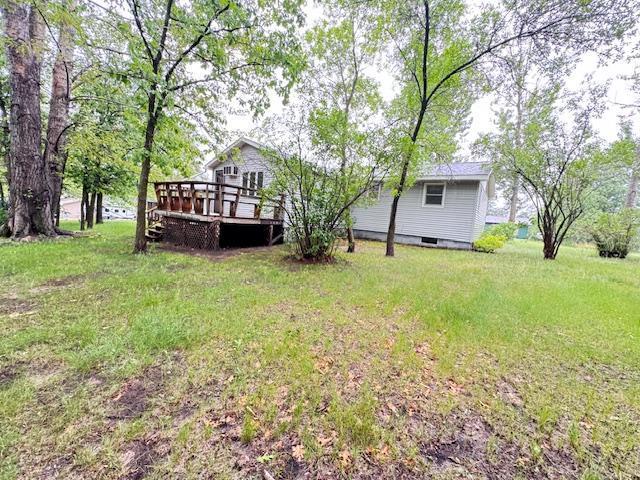 517 2nd St NW, Menahga, MN 56464 - view of grassy yard featuring a deck