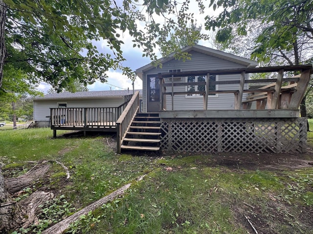 517 2nd St NW, Menahga, MN 56464 - back of house with a deck and stairs