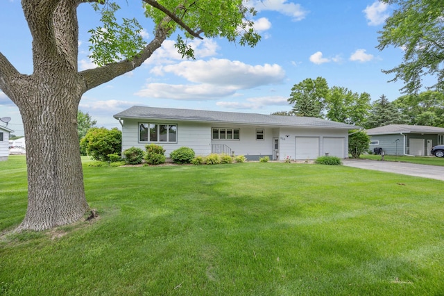226 Ash Ave, Bird Island, MN 55310 - view of front of property with an attached garage, asphalt driveway, and a front lawn