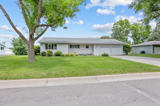 226 Ash Ave, Bird Island, MN 55310 - single story home with an attached garage, driveway, and a front lawn