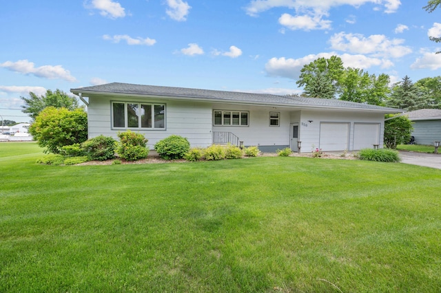 226 Ash Ave, Bird Island, MN 55310 - ranch-style home featuring an attached garage, a front lawn, and driveway
