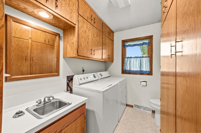 226 Ash Ave, Bird Island, MN 55310 - washroom featuring washer and clothes dryer and a textured ceiling