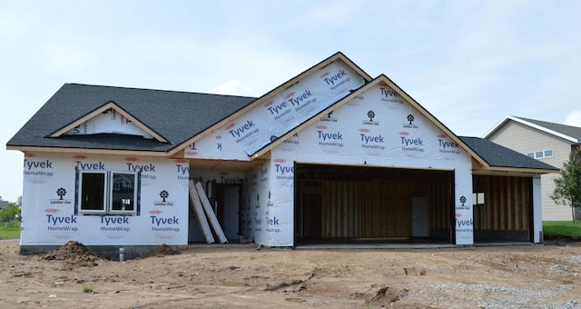 1303 Iris Ln, Saint Joseph, MN 56374 - property under construction with an attached garage, roof with shingles, and dirt driveway